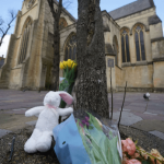 Police officers outside All Saints Church in Notting Hill, London, where a newborn baby was found dead in a shopping bag