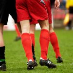 Why Do Footballers Cut Holes in Their Socks
