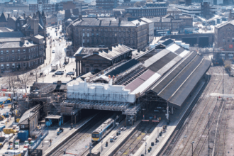 Huddersfield railway station platforms and tracks undergoing renovation during the Transpennine Route Upgrade works.