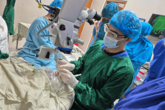 Mahi Muqit of London’s Moorfields Eye Hospital performing surgery in an operating theatre in Bangladesh