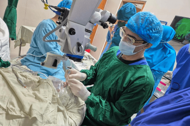Mahi Muqit of London’s Moorfields Eye Hospital performing surgery in an operating theatre in Bangladesh