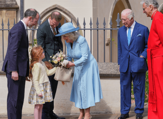 Queen Camilla wearing a pale blue coat dress and rose-trimmed hat, attending the Easter Matins Service at St George’s Chapel, Windsor.