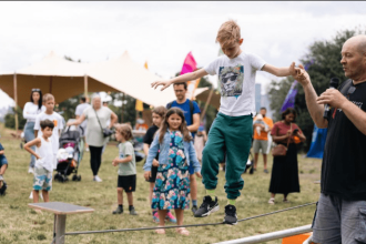 Crowds enjoying Summer in the Park 2025 festival in Greenwich and Bexley with live performances and community events.