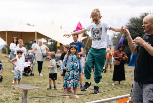 Crowds enjoying Summer in the Park 2025 festival in Greenwich and Bexley with live performances and community events.