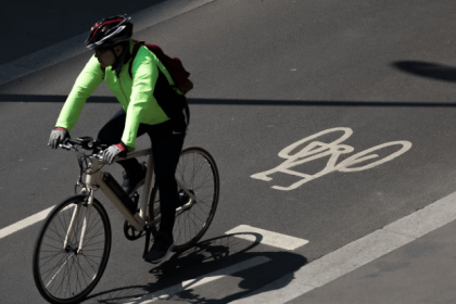 Cyclist Riding on Urban Road