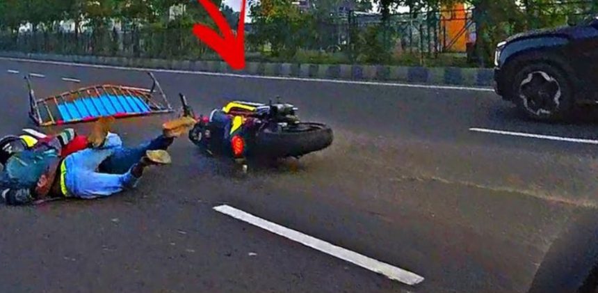 Motorcyclist hits road barrier