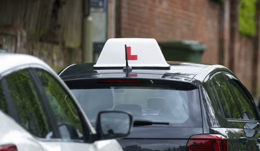 Learner's Board over a Car